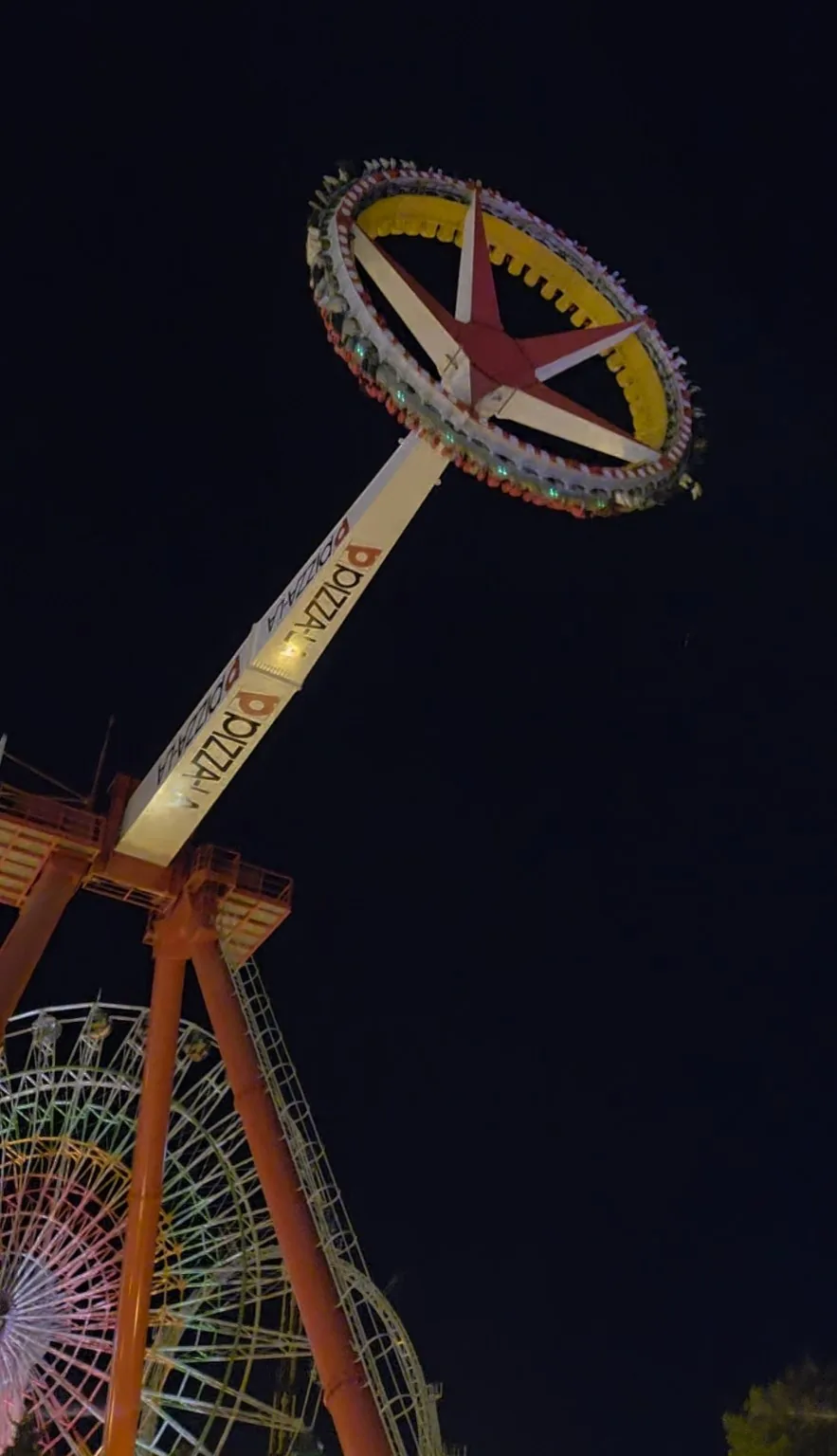 Tondemina's circular seating platform high above the park at night