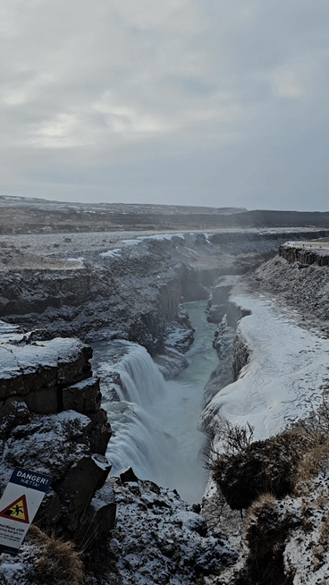 Water from Gullfoss dropping continuously into the deep winter canyon