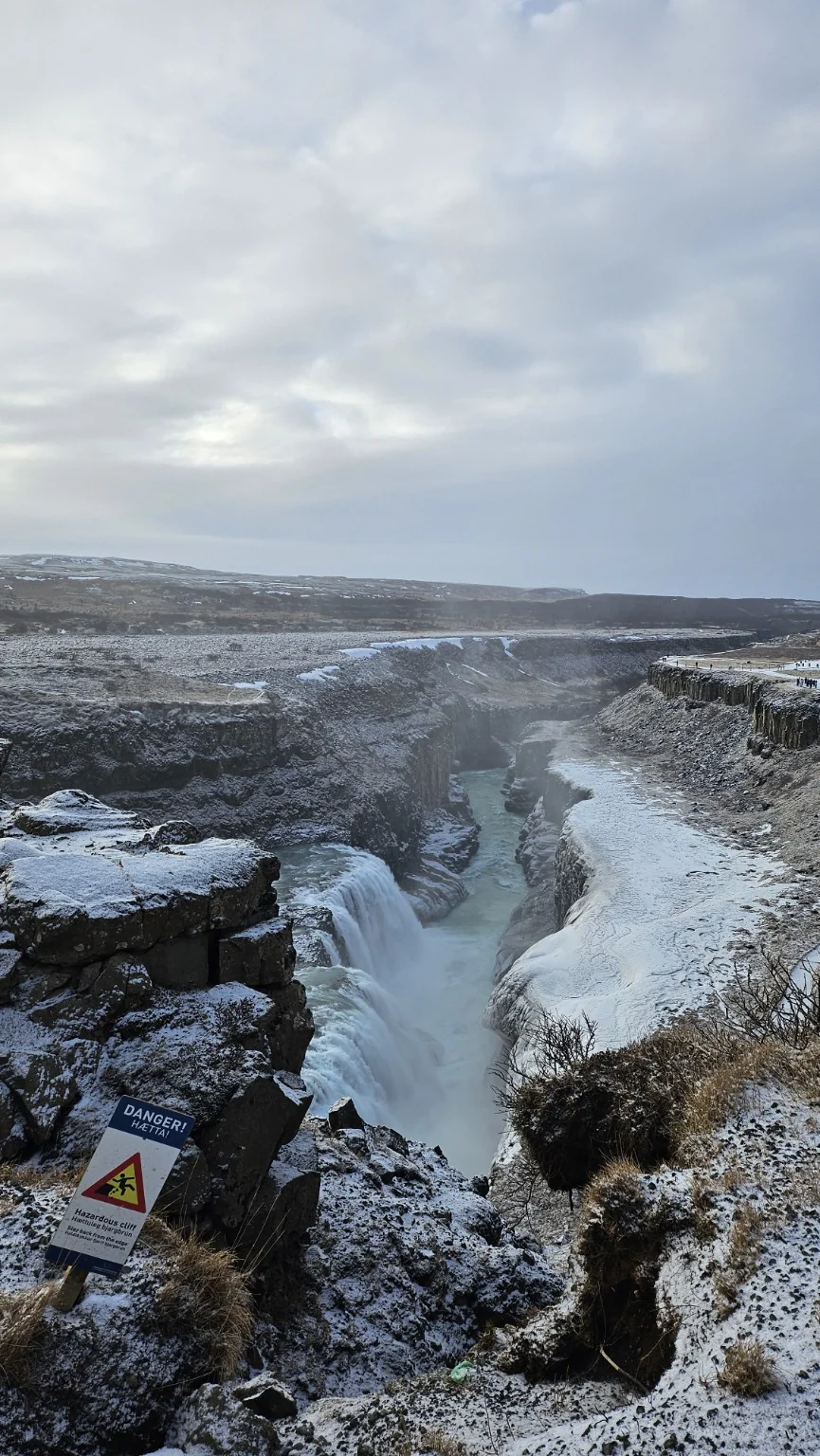 Gullfoss dropping into a deep snow-covered canyon below the upper falls