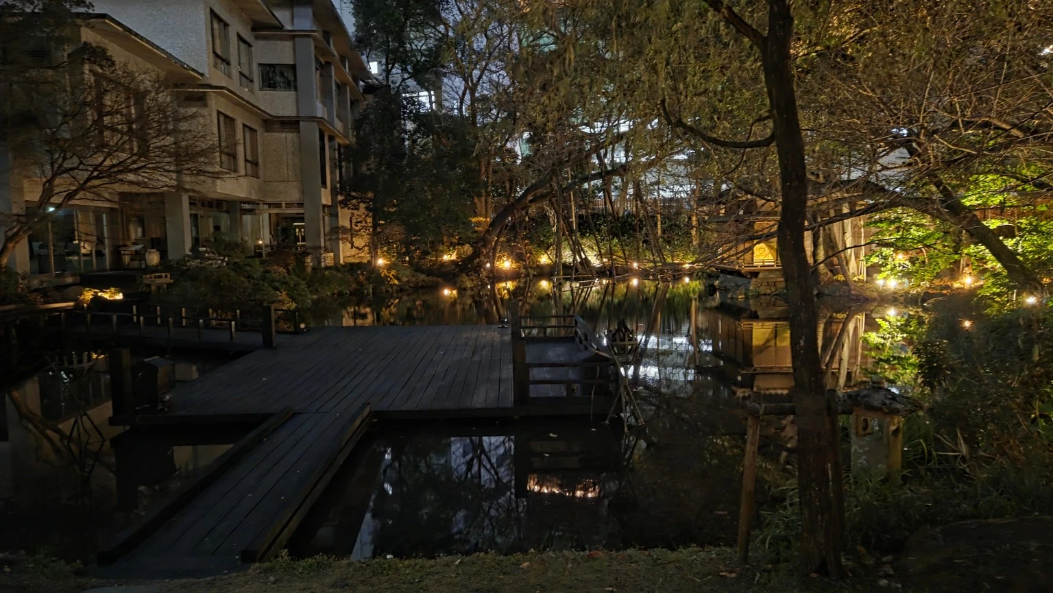 Fugetsuro garden and pond illuminated at night behind Hotel Garden Square Shizuoka