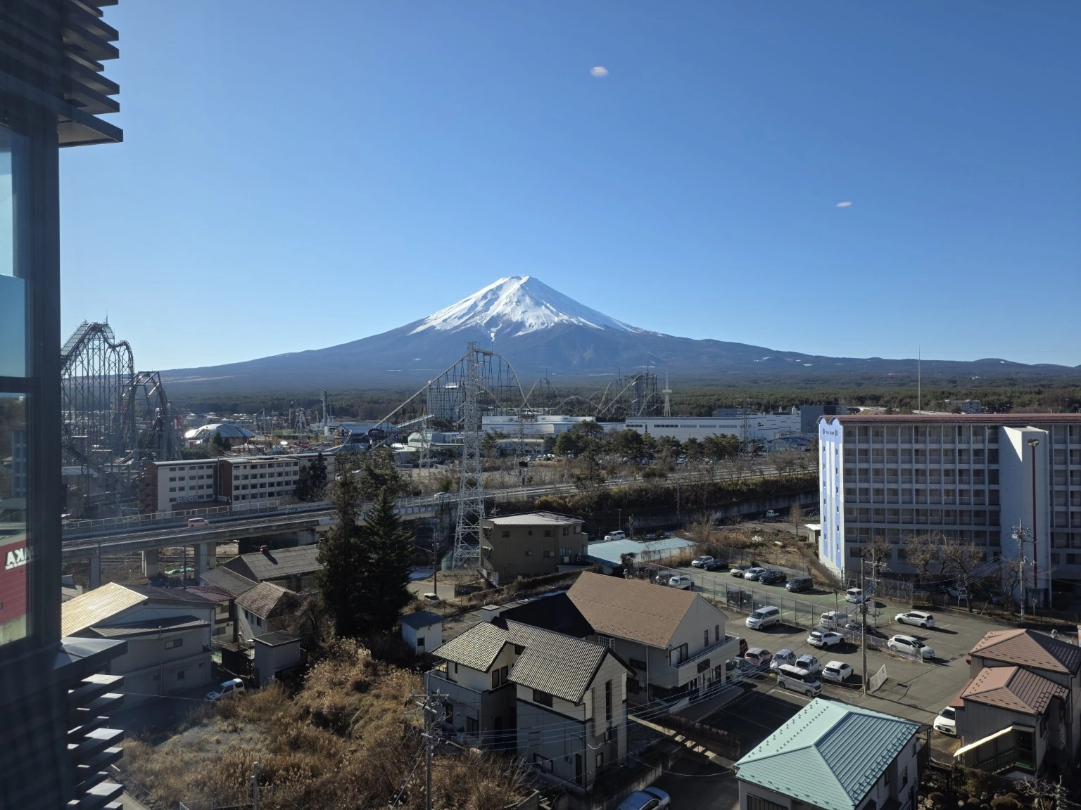 Mount Fuji and Fuji-Q Highland seen clearly from the hotel room window in the morning